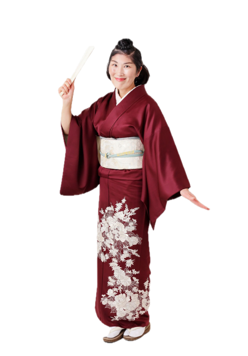 Kanda Masami, kodan storyteller, in kimono raising a paper fan